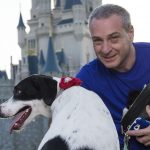 LAKE BUENA VISTA, FL - AUGUST 30: In this handout photo provided by Disney Parks, Francisco Aguerre and his dog "Lily" pose at the Magic Kingdom at Walt Disney World Resort August 30, 2014 in Lake Buena Vista, Florida. The two-year-old Labrador-Catahoula was born with markings on her back that form a near-perfect Mickey Mouse silhouette. Lily was one of 101 dogs invited to the Magic Kingdom today for "Disney Side Dog's Day." The event will be featured on an Animal Planet network TV special that will air Oct. 18, 2014. (Photo by David Roark/Disney Parks via Getty Images)
