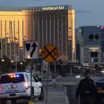 Police form a perimeter around the road leading to the Mandalay Hotel (background) after a gunman killed at least 50 people and wounded more than 400 others when he opened fire on a country music concert in Las Vegas, Nevada on October 2, 2017. The gunman who opened fire on concertgoers from 32nd floor of a Las Vegas hotel was found dead, apparently of a self-inflicted gunshot wound, when a police SWAT team burst in, authorities said Monday.They said at least eight weapons, including a number of long rifles, were found in the room from where 64-year-old Stephen Paddock rained automatic fire into thousands of terrified people attending a country music concert across the street."We believe the individual killed himself prior to our entry," Las Vegas Sheriff Joseph Lombardo said. / AFP PHOTO / Mark RALSTON (Photo credit should read MARK RALSTON/AFP/Getty Images)